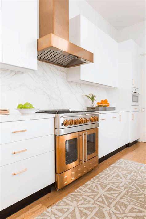 white cabinets and copper countertops